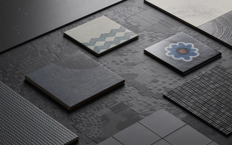 Patterned and plain tiles laid on a dark floor